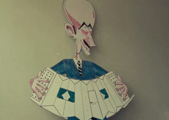 Caricature du président de la République Valéry Giscard d'Estaing jouant de l'accordéon.